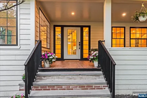 a view of a entryway door front of a house