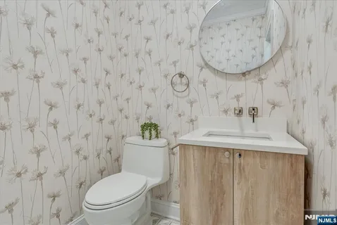 a bathroom with a toilet and a sink