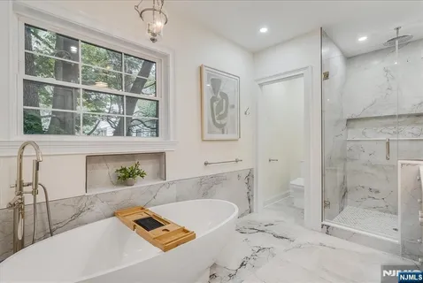a utility room with sink dryer and washer