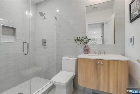 a bathroom with a toilet a sink and bathtub