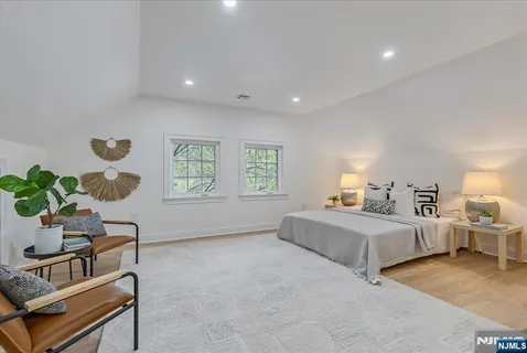 a bathroom with a sink a mirror and a shower