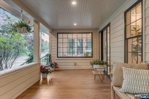 a living room filled with furniture and a large window