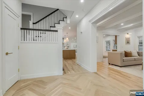 a view of a livingroom with furniture and staircase