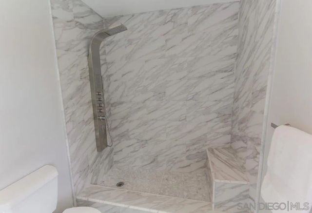 a view of a patio with table and chairs and potted plants