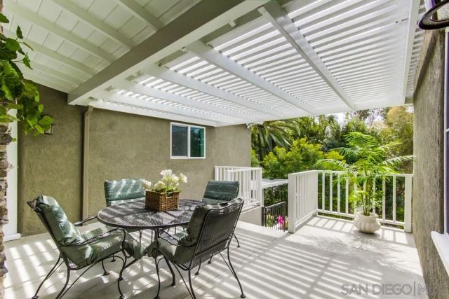 a patio with table and chairs