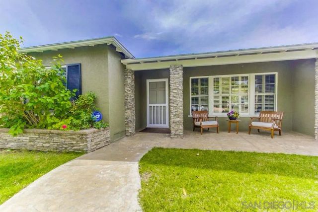 a backyard of a house with seating space