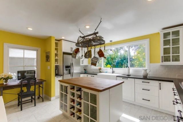 a kitchen with a stove a sink and a refrigerator