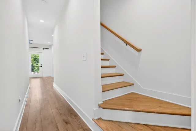 a view of entryway with wooden floor