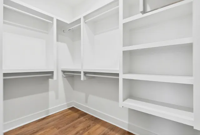 a view of an empty walk in closet