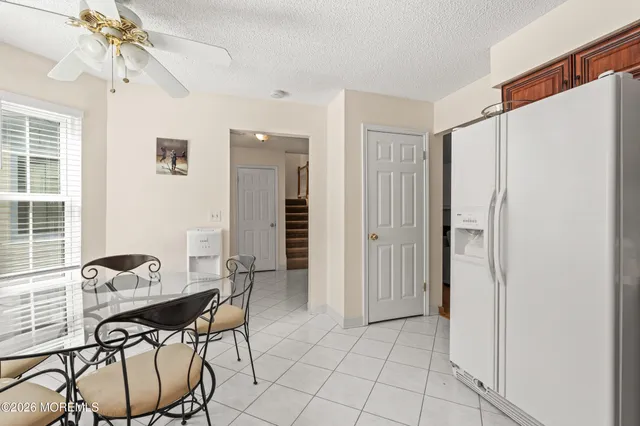 a view of a livingroom with furniture and a window