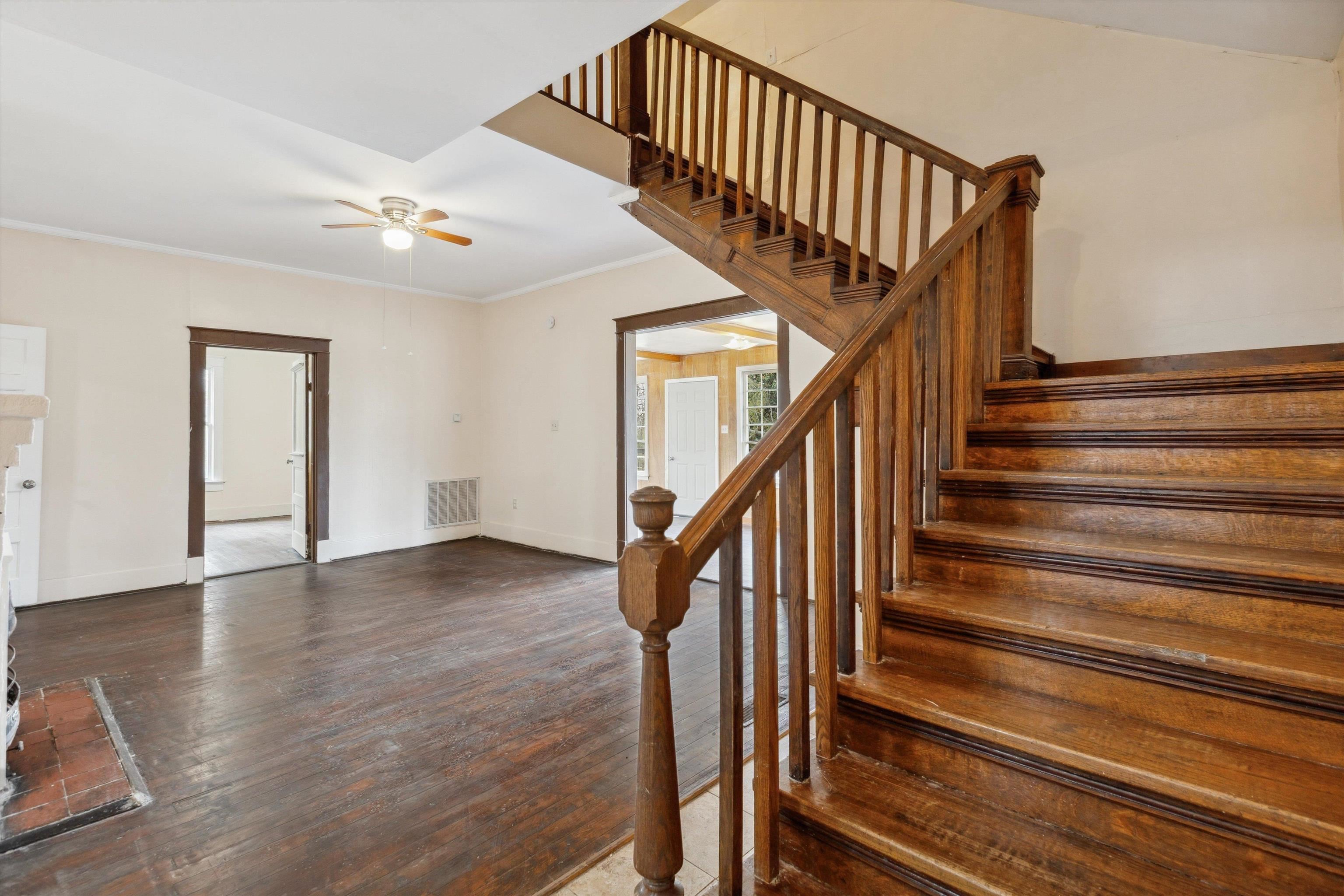 8457 East Kerrville Rosemark Road Millington, TN 38053 - Photo 15 of 25 Stairway featuring wood-type flooring, a ceiling fan, and crown molding