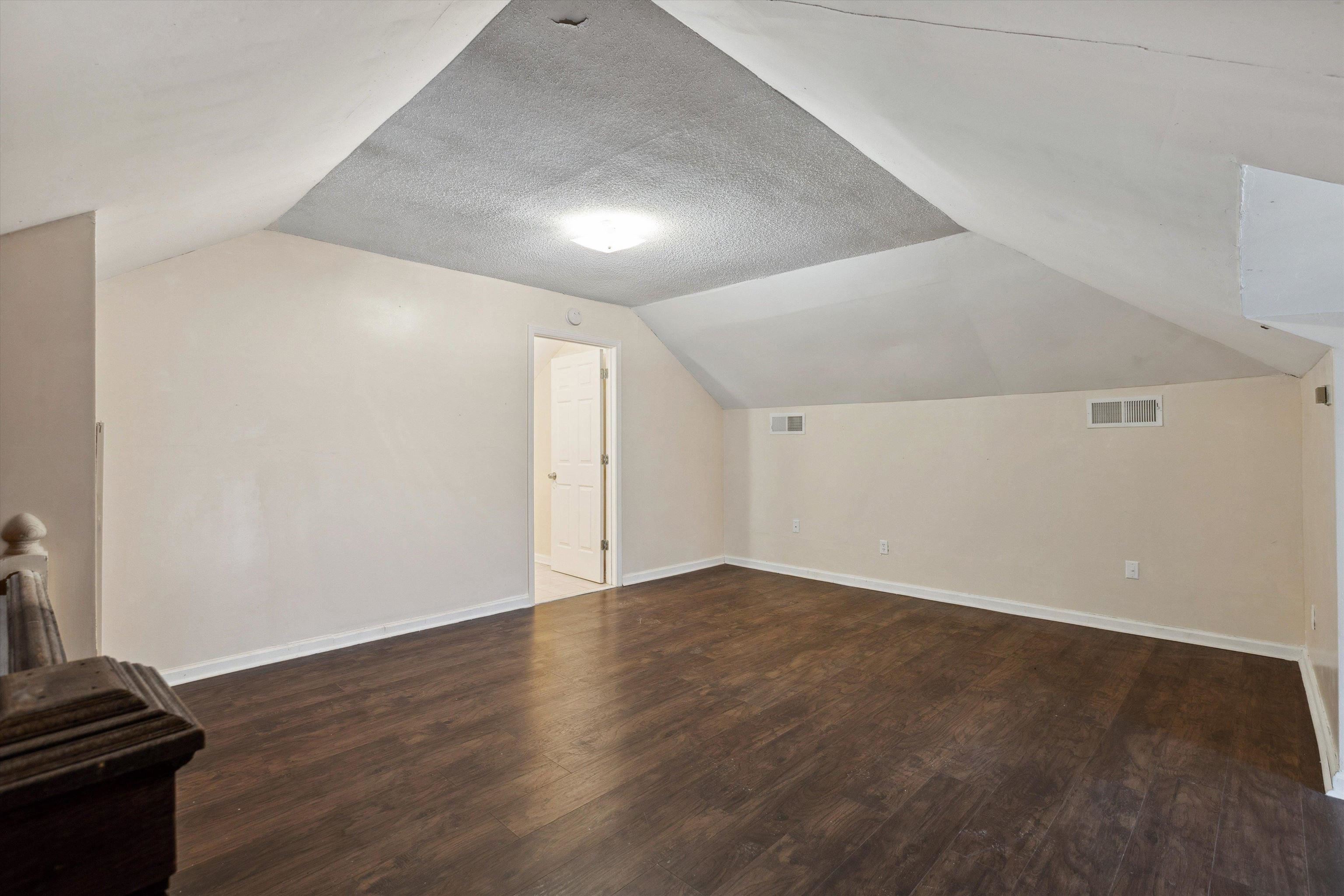 8457 East Kerrville Rosemark Road Millington, TN 38053 - Photo 16 of 25 Additional living space with dark wood finished floors and baseboards