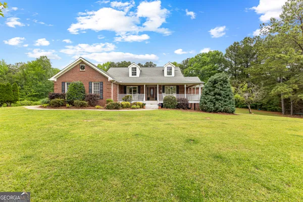 a front view of a house with a yard
