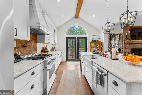 a view of kitchen with cabinets and wooden floor