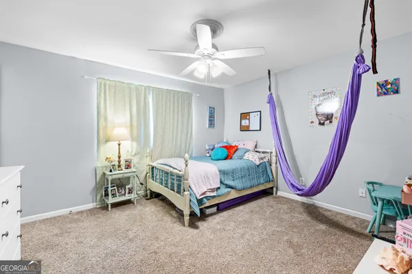 a bedroom with bed and cabinets