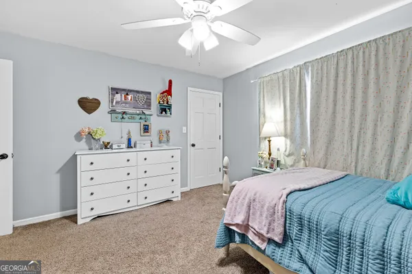 an empty room with furniture fireplace and windows