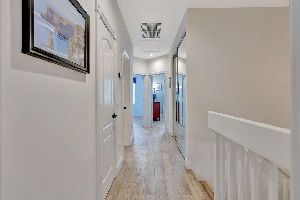 180 Freeport Drive Jupiter, FL 33458 - Photo 35 of 58 a view of hallway with stairs