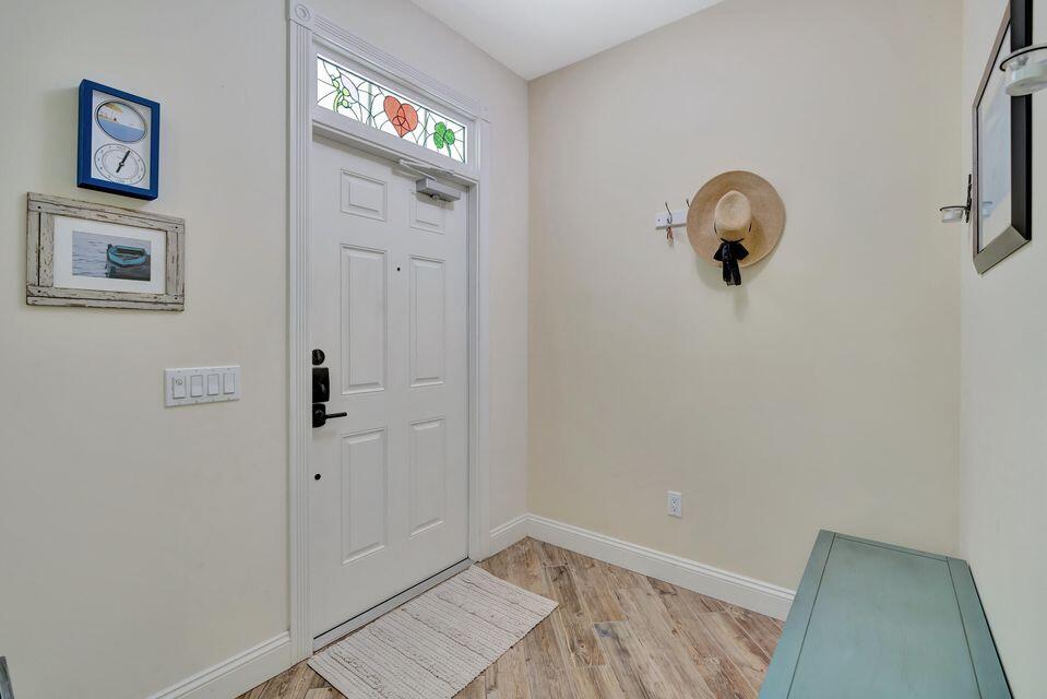 180 Freeport Drive Jupiter, FL 33458 - Photo 4 of 58 a view of a hallway with closet