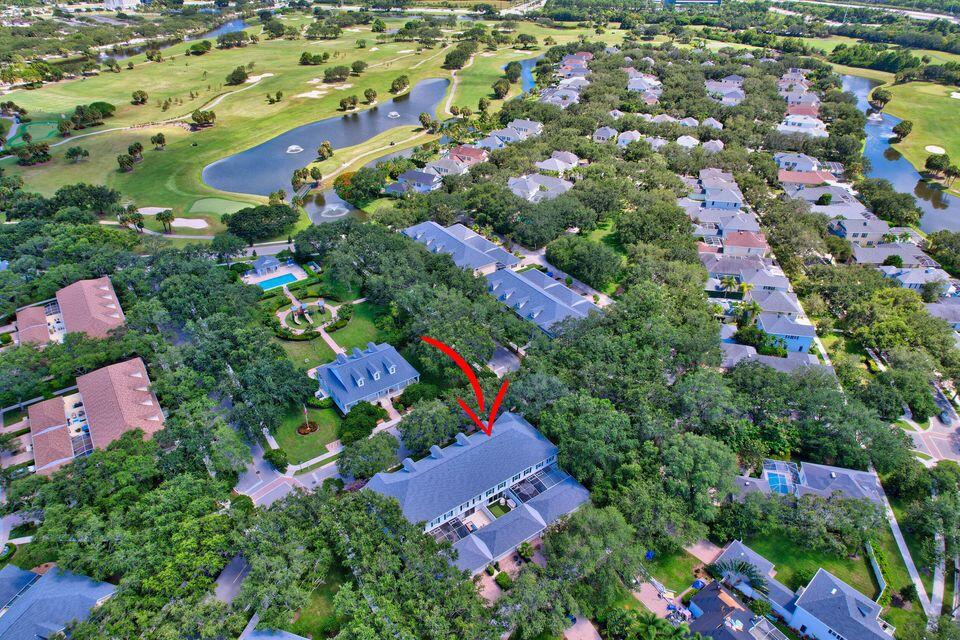 180 Freeport Drive Jupiter, FL 33458 - Photo 53 of 58 an aerial view of residential house with outdoor space and swimming pool