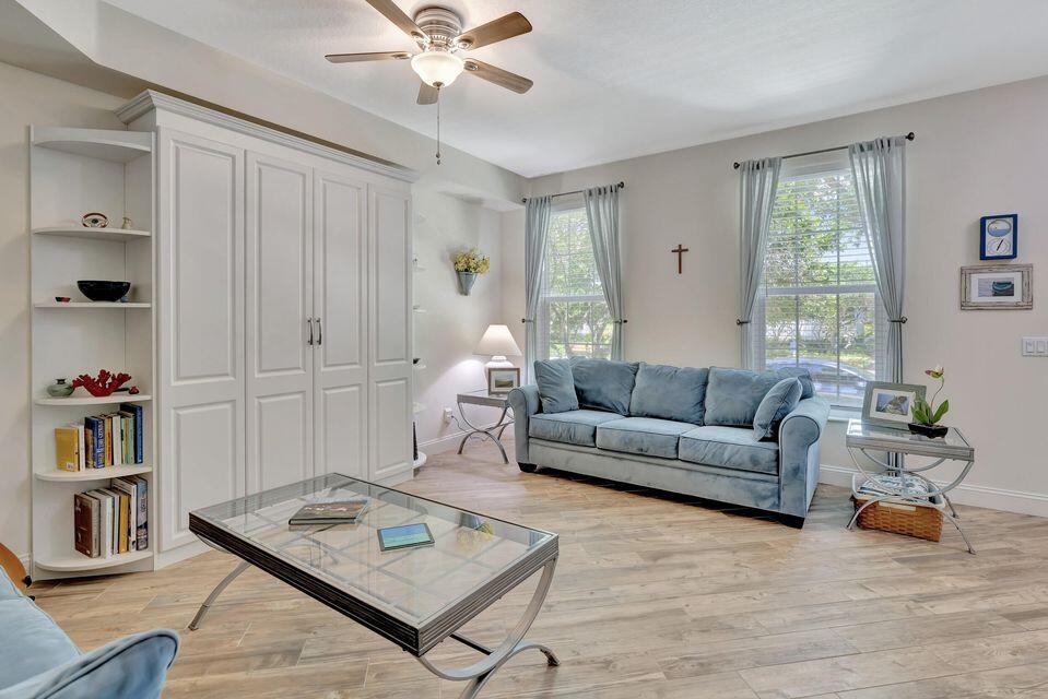 180 Freeport Drive Jupiter, FL 33458 - Photo 6 of 58 a living room with furniture and a window