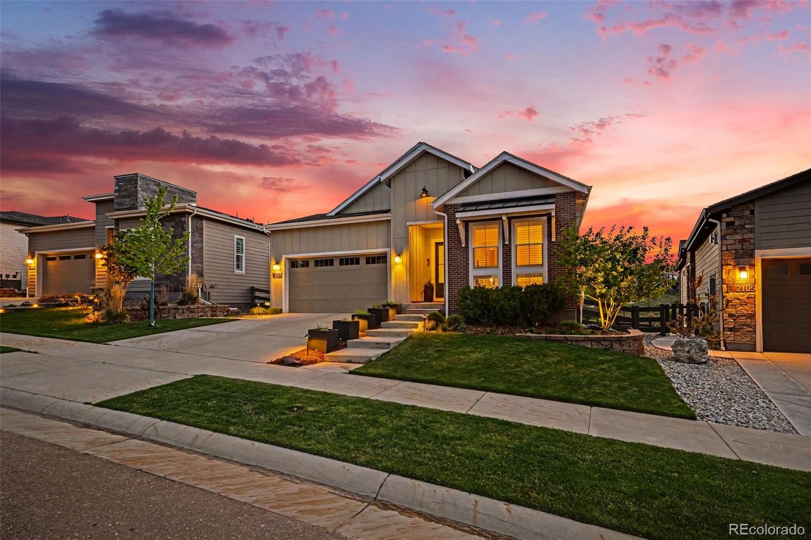 2101 Rim Ridge Drive Castle Pines, CO 80108 - Photo 42 of 50 a view of a house with backyard sitting area and garden