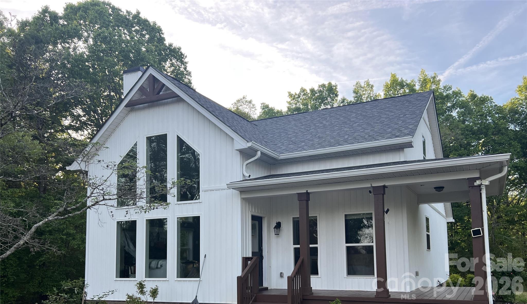 a view of house with yard