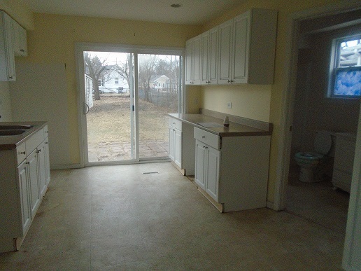 1213 West Main Street Ottawa, IL 61350 - Photo 3 of 10 a kitchen with granite countertop a cabinets and a stove top oven