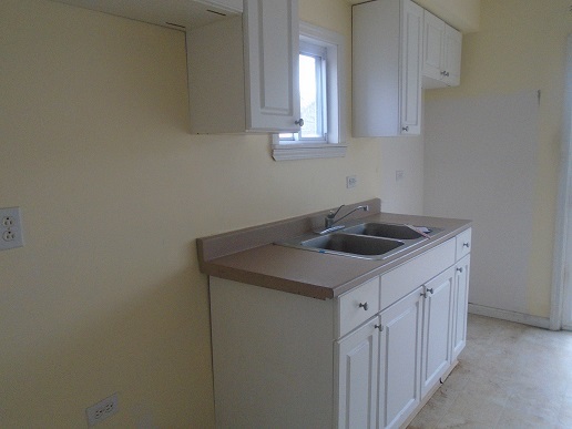 1213 West Main Street Ottawa, IL 61350 - Photo 4 of 10 a kitchen with a sink cabinets and utility