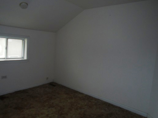 1213 West Main Street Ottawa, IL 61350 - Photo 8 of 10 an empty room with a window