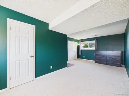 a room with a bed and a window