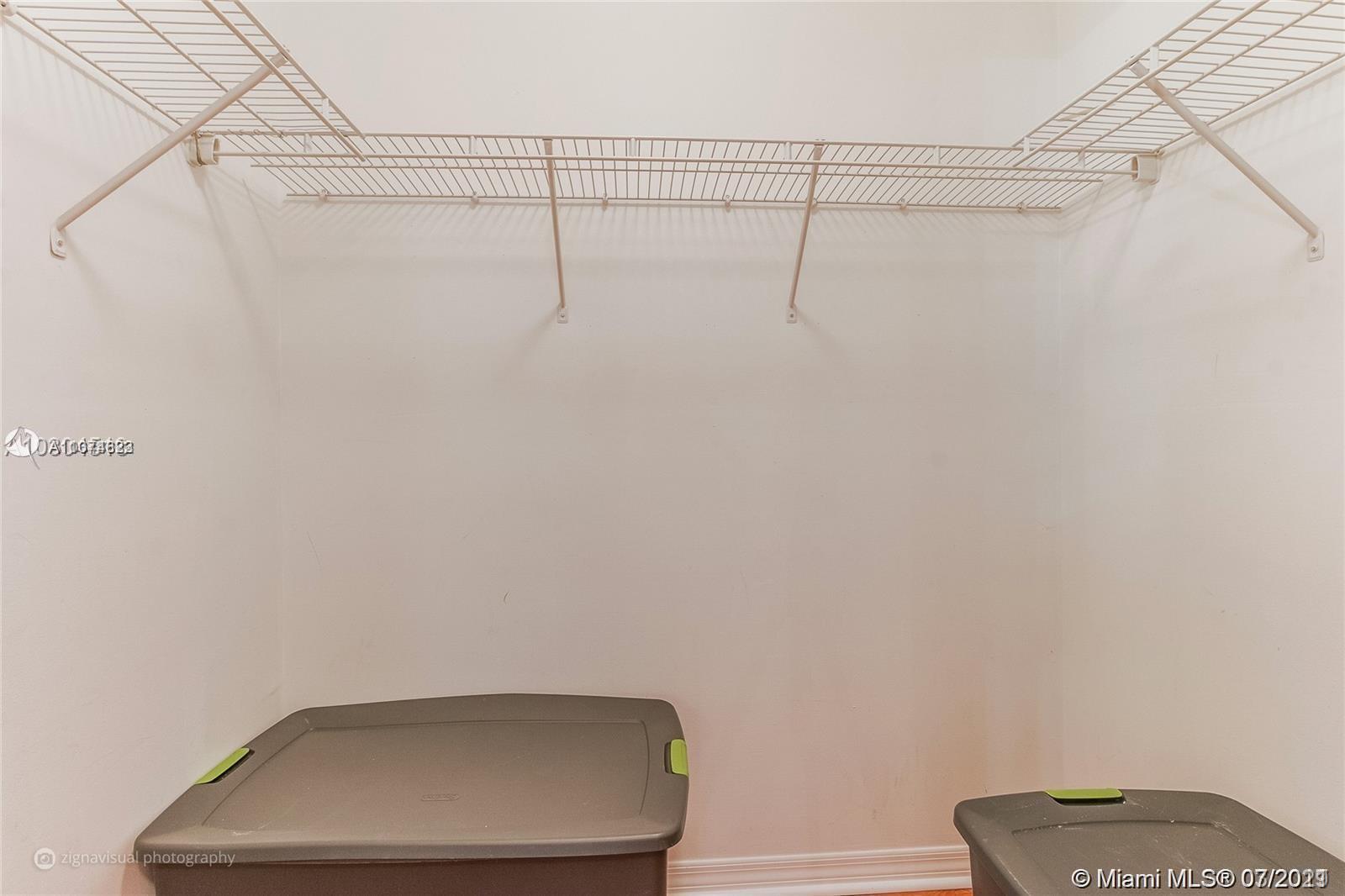 1450 Southeast 3rd Avenue, Unit 107 Dania Beach, FL 33004 - Photo 11 of 15 a view of small space with racks on the wall