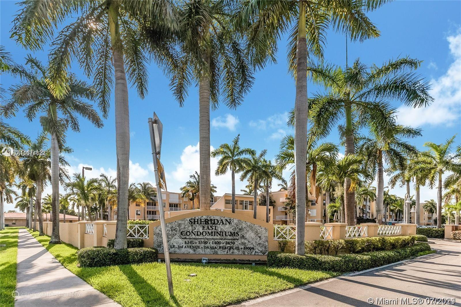 1450 Southeast 3rd Avenue, Unit 107 Dania Beach, FL 33004 - Photo 15 of 15 a view of outdoor space with trees