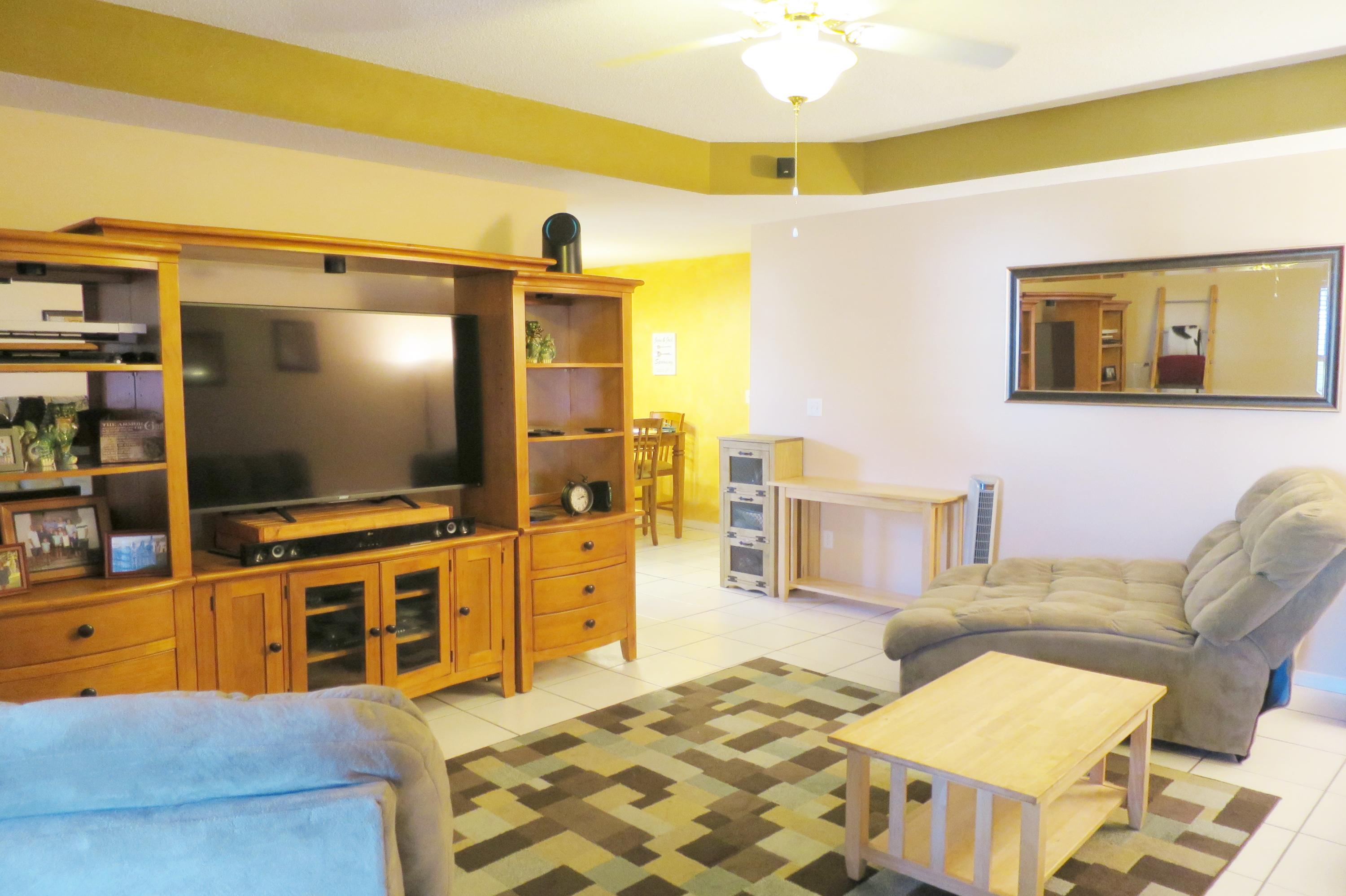 1762 Old Ranch Road Fort Walton Beach, FL 32547 - Photo 5 of 21 a living room with furniture and a flat screen tv