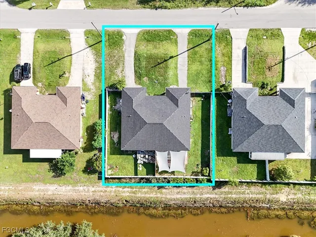 an aerial view of houses with yard