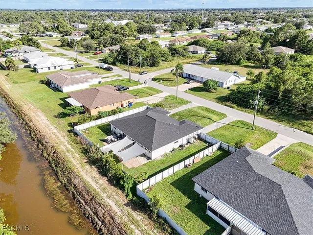an aerial view of a house with a ocean view