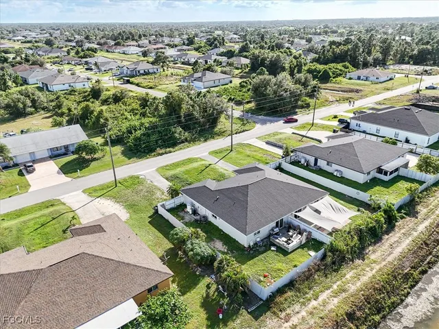 an aerial view of a house with a swimming pool