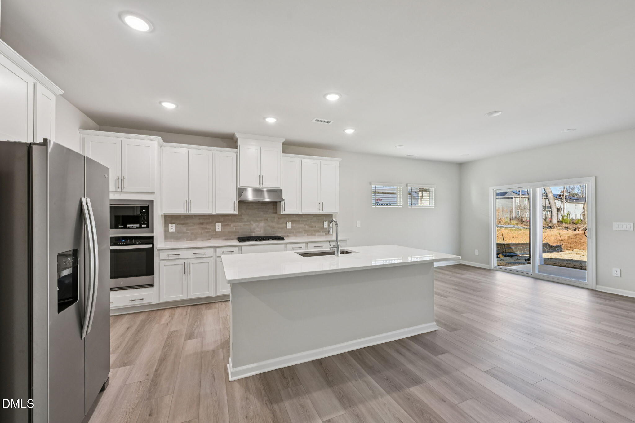 2145 Topsail Road Durham, NC 27703 - Photo 12 of 49 a kitchen with a sink stainless steel appliances and cabinets