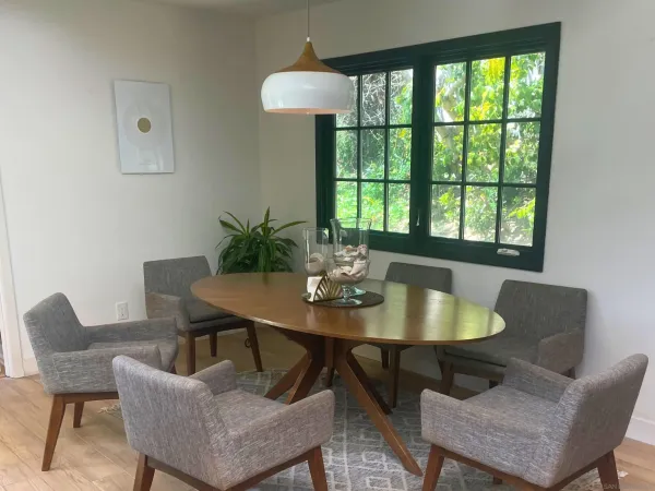 a view of a dining room with furniture window and outside view