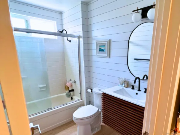 a bathroom with a sink toilet and shower
