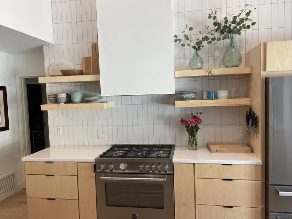 a kitchen with a stove and cabinets