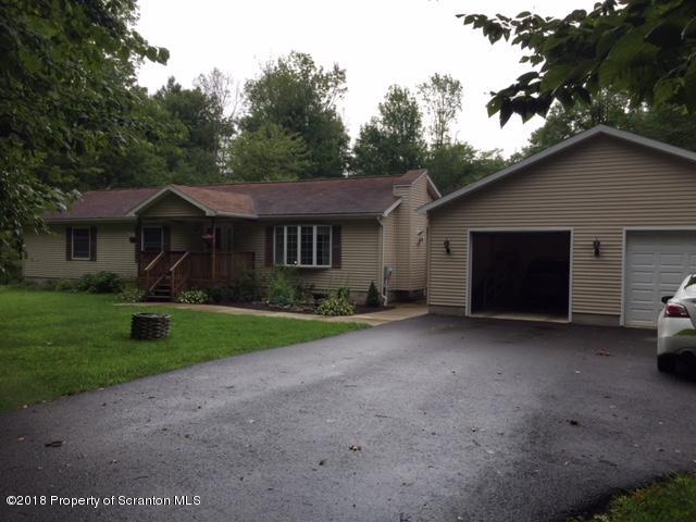 1970 Motichka Road Moscow, PA 18444 - Photo 1 of 22 a view of a house with a yard and large tree