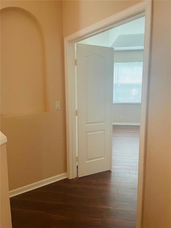 6008 Spring Lake Terrace Fort Pierce, FL 34951 - Photo 12 of 33 a view of an empty room with wooden floor and a window