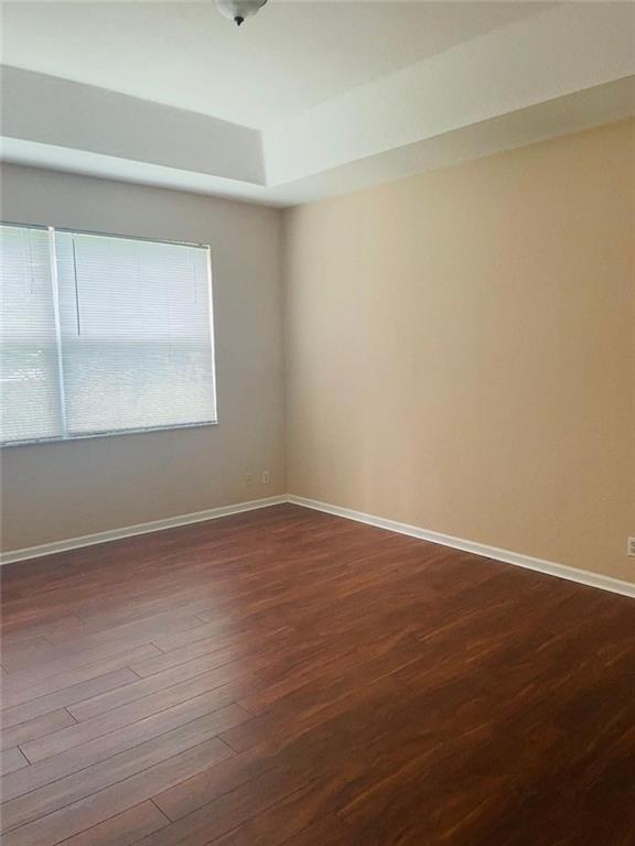 6008 Spring Lake Terrace Fort Pierce, FL 34951 - Photo 14 of 33 a view of an empty room with wooden floor and a window