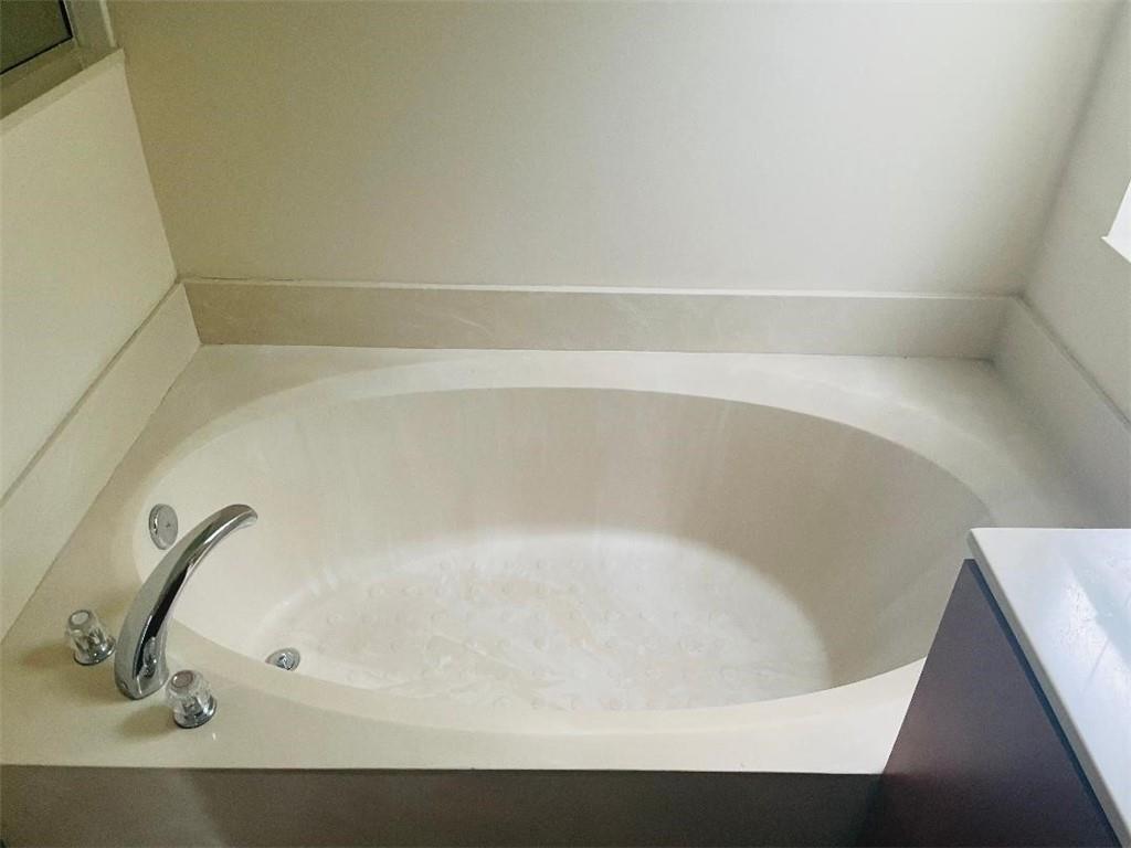 6008 Spring Lake Terrace Fort Pierce, FL 34951 - Photo 16 of 33 a bathroom with a bathtub