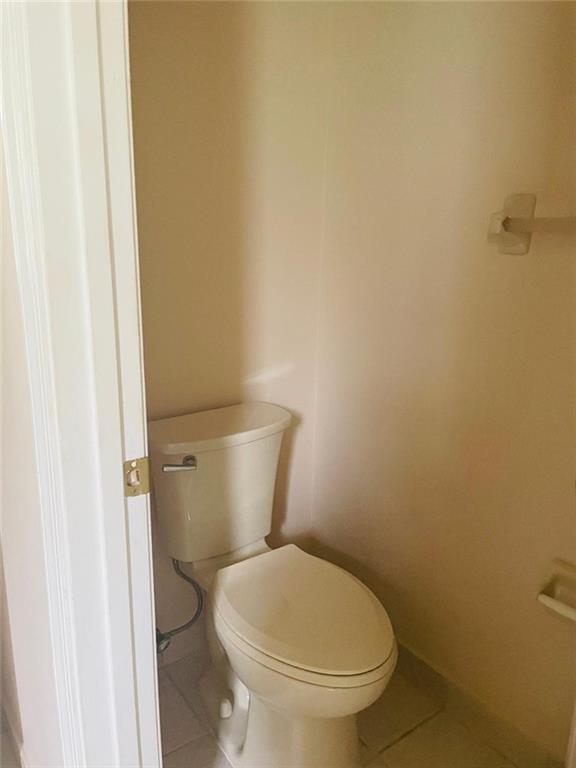 6008 Spring Lake Terrace Fort Pierce, FL 34951 - Photo 17 of 33 a white toilet sitting next to a white wall
