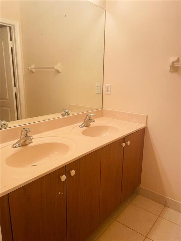 6008 Spring Lake Terrace Fort Pierce, FL 34951 - Photo 19 of 33 a bathroom with a sink and a mirror