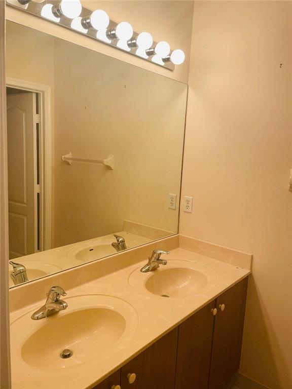 6008 Spring Lake Terrace Fort Pierce, FL 34951 - Photo 20 of 33 a bathroom with a sink and a mirror