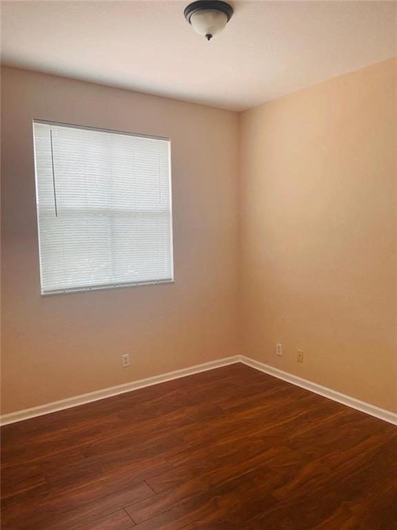 6008 Spring Lake Terrace Fort Pierce, FL 34951 - Photo 7 of 33 a view of a small space with wooden floor and a window