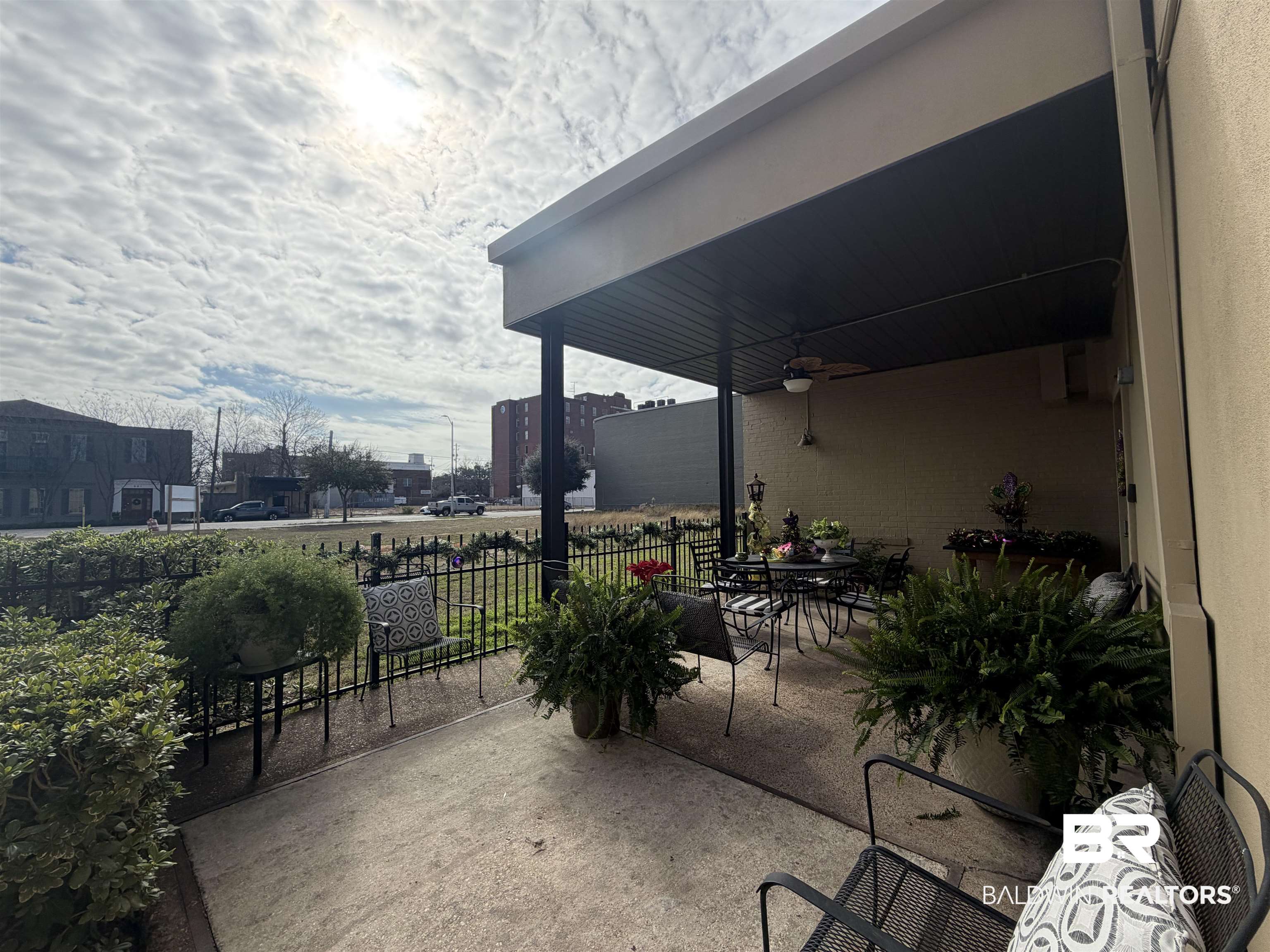 308 St Louis Street, Unit 101 Mobile, AL 36602 - Photo 29 of 30 View of patio / terrace featuring outdoor dining space and a ceiling fan