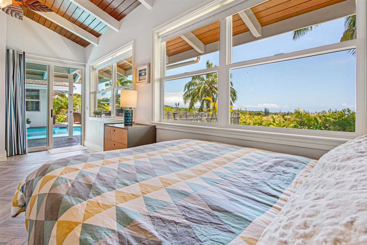 330 West Kuiaha Road Haiku, HI 96708 - Photo 23 of 30 a bedroom with a bed and a large window